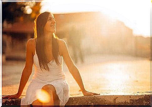 Happy woman during the sunset