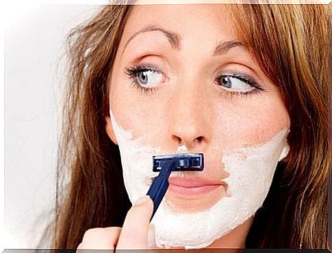 Woman shaving stubble, polycystic ovary syndrome