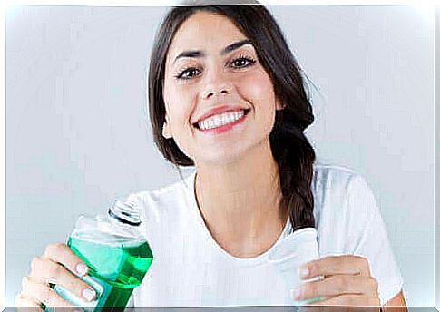 Woman with mouthwash