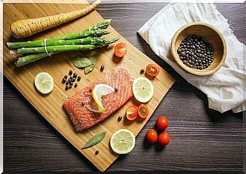 Salmon and vegetables on a wooden board