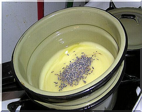 ingredients for lavender soap in a pot