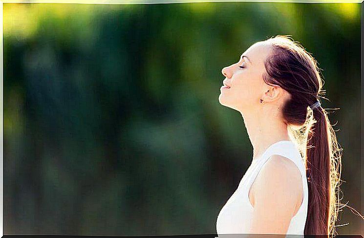 A woman practicing proper breathing.