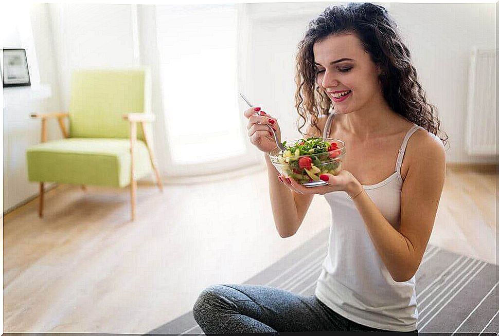 Woman with a bowl of salad.