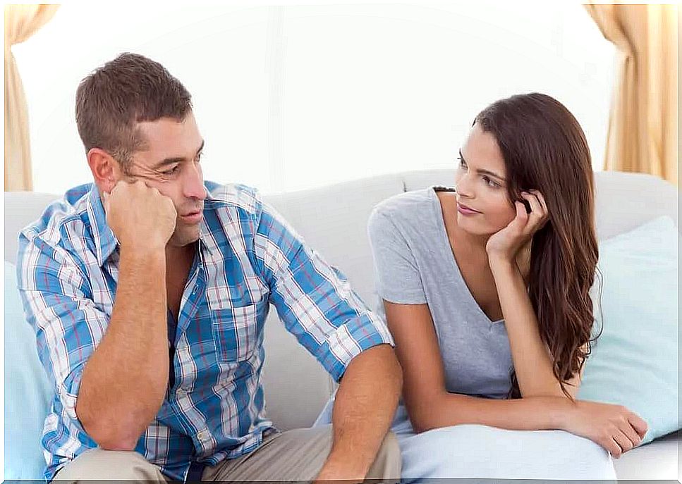 A woman and a man are sitting and talking