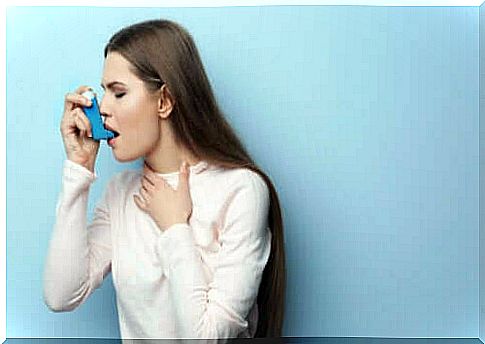 Woman using an inhaler