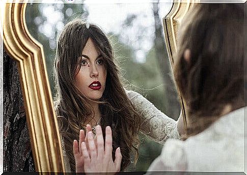 Reflection of a woman in the mirror