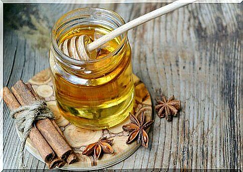 a jar of honey with cinnamon